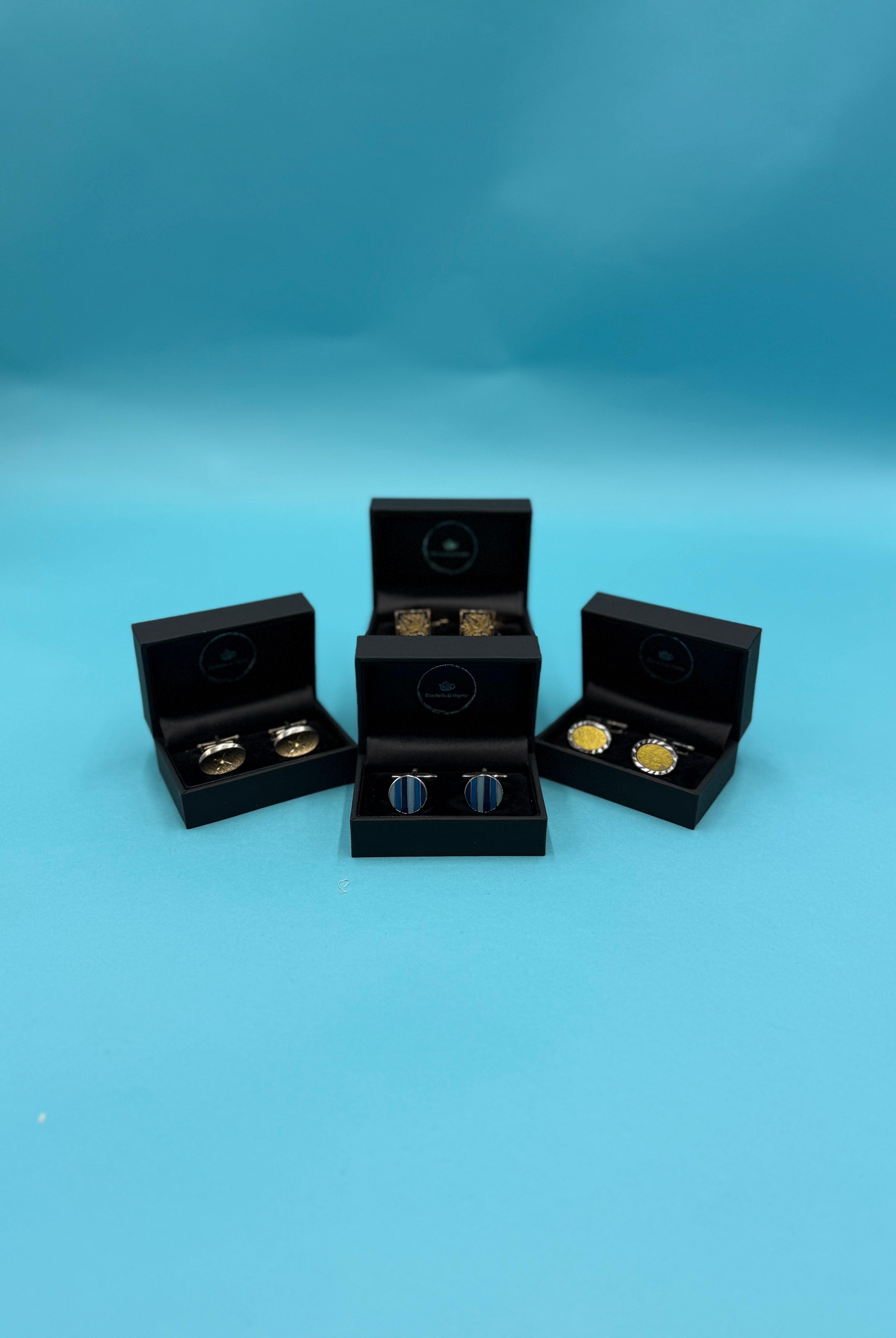 Close-up of diverse vintage cufflinks, destined for a Bluebells & Thyme gift box.