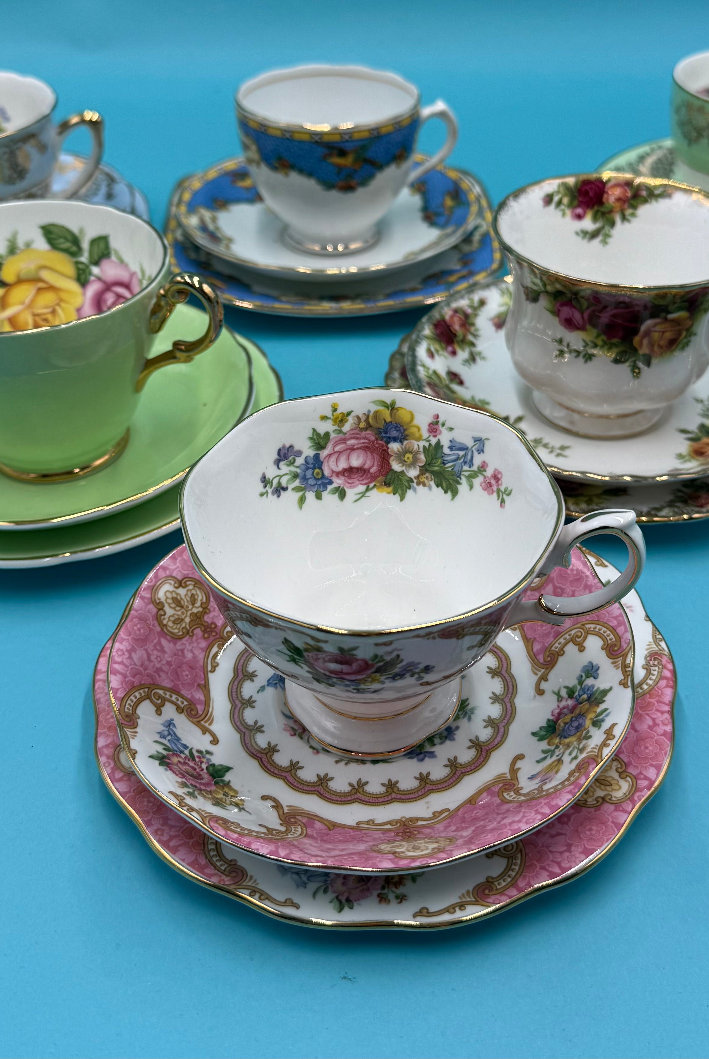 A curated selection of vintage tea cups, saucers, and side plates from Bluebells & Thyme.