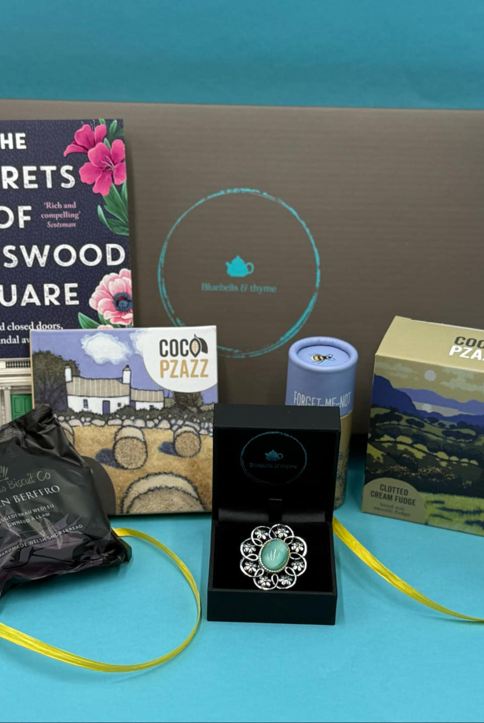 bluebells and thyme just because letterbox gift box including vintage broach, one book, handcrafted bookmark, artisan welsh treats