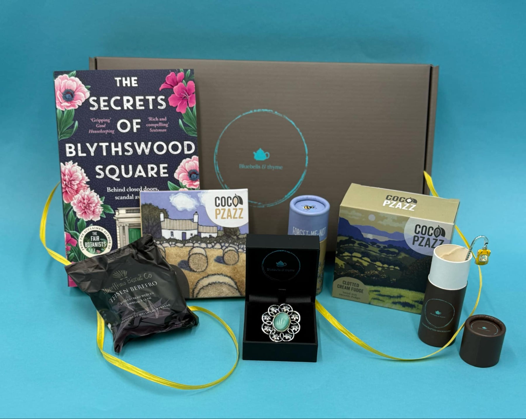 bluebells and thyme just because letterbox gift box including vintage broach, one book, handcrafted bookmark, artisan welsh treats