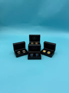 Close-up of diverse vintage cufflinks, destined for a Bluebells & Thyme gift box.