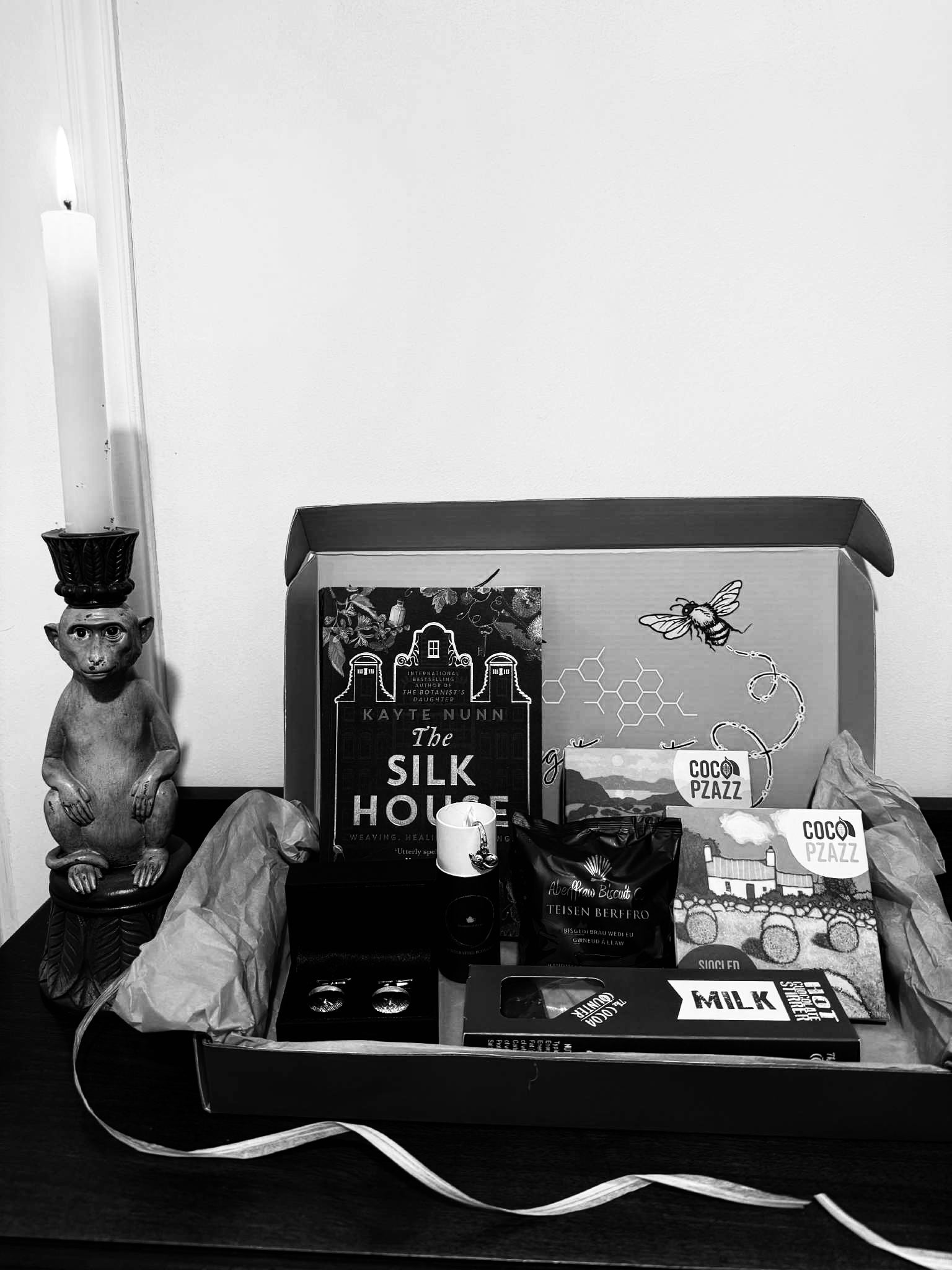 Letterbox gift including Silk House by Kayte Nunn, vintage cufflinks and welsh artisan food